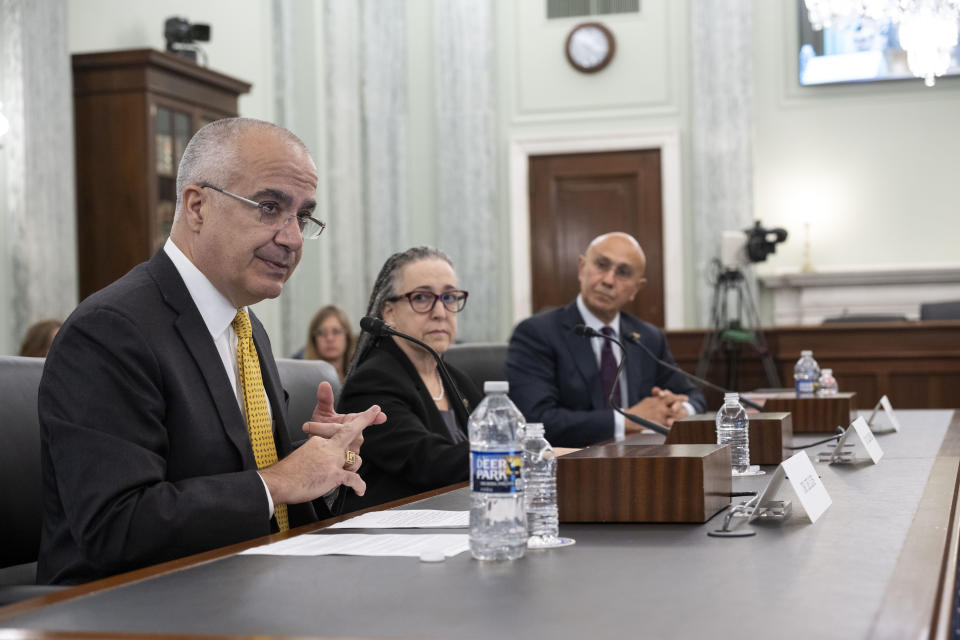 Dr. Javier de Luis, left, testifies before the Senate Commerce, Science, and Transportation hearings to examine the FAA Organization Designation Authorization (ODA) Expert Panel Report with Dr. Tracy Dillinger, center and Dr. Najmedin Meshkation on Capitol Hill, Wednesday, April 17, 2024, in Washington. (AP Photo/Kevin Wolf)