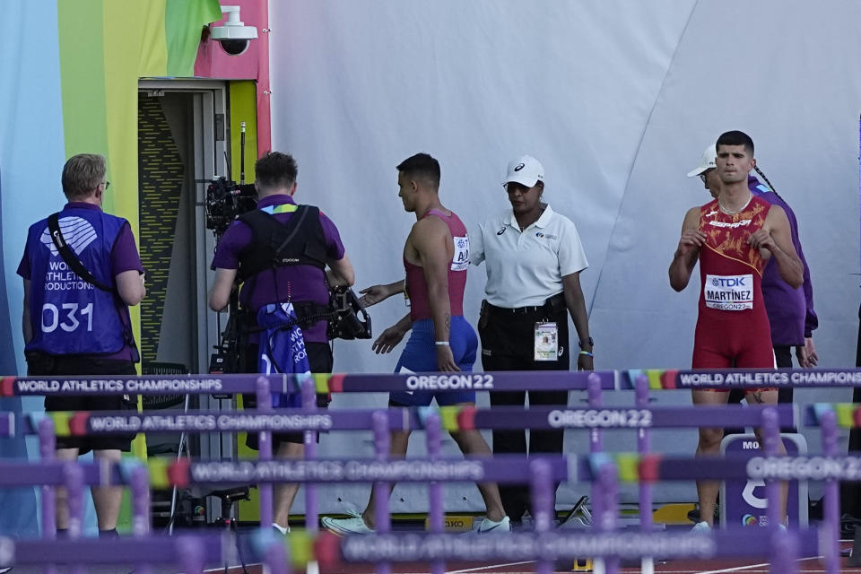 Devon Allen, of the United States, leaves the track after getting disqualify in the 110 mens hurdles final at the World Athletics Championships on Sunday, July 17, 2022, in Eugene, Ore. (AP Photo/David J. Phillip)