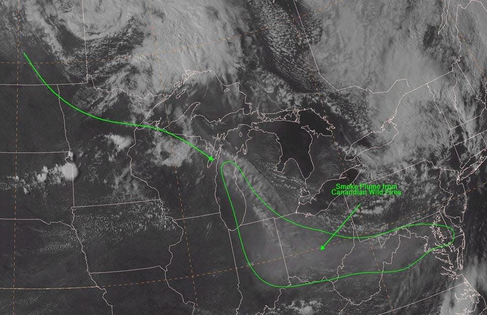 A satellite image shows smoke from Canadian wildfires hovering over the Ohio River valley and the mid-Atlantic region Tuesday.