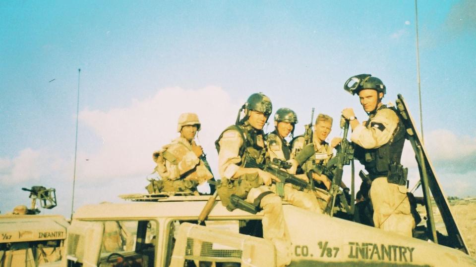 Members of 3rd Platoon on the company Humvee with some of the Delta Force operators the morning after the Battle of Mogadishu. (Photo courtesy of John Suprynowicz)