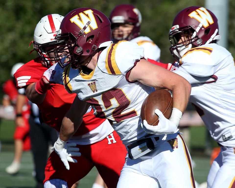Weymouth's Cameron Aieta looks to turn the corner while rushing the ball during first quarter action of their game against Hingham at Hingham High on Saturday, Sept. 24, 2022. 