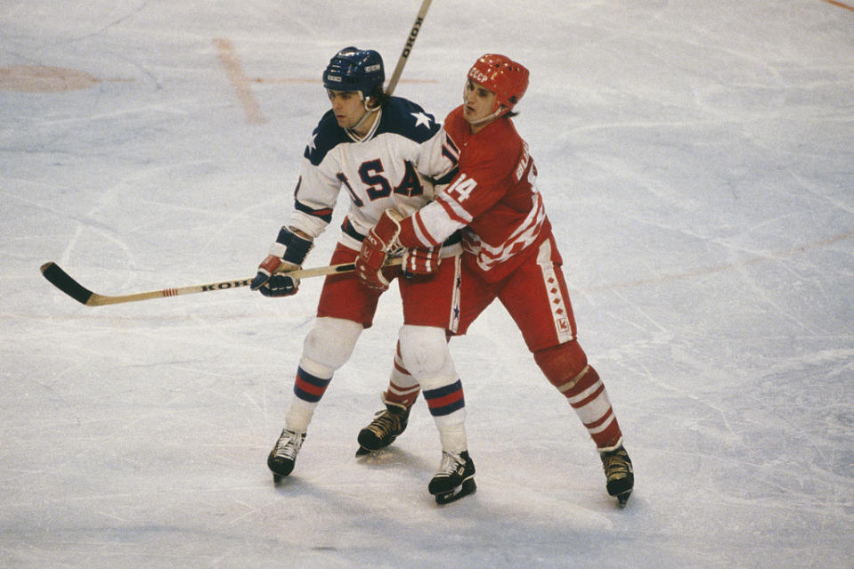 LAKE PLACID, NY - FEBUARY 1980: Team USA's Steve Christoff #11 stands his groud against Zinetula Bilyaletdinov #14 of the Soviet Union during the XIII Olympic Winter Games in February of 1980 in Lake Placid, New York.