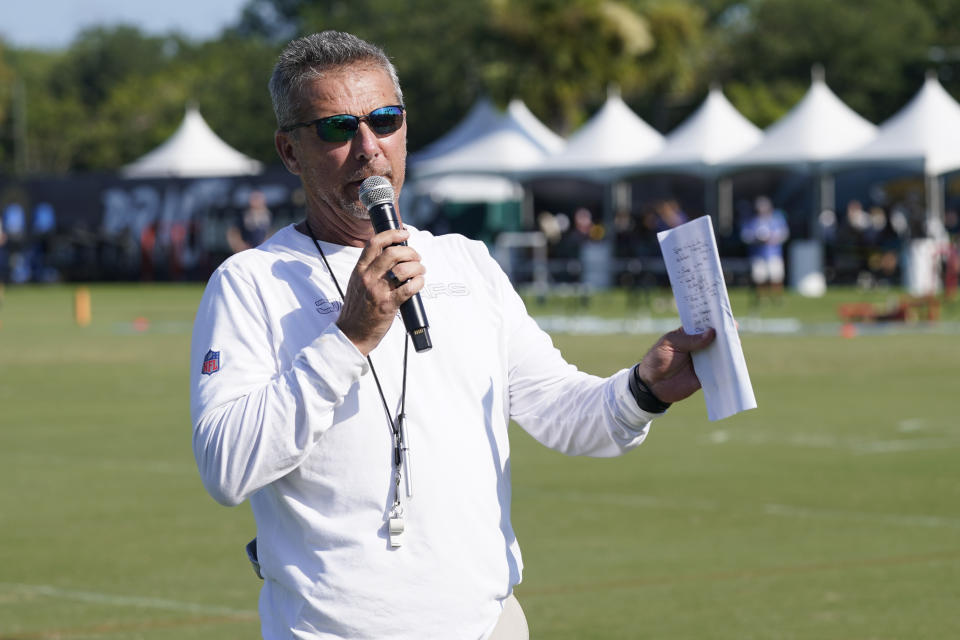 Jacksonville Jaguars head coach Urban Meyer makes remarks to fans before an NFL football practice, Saturday, July 31, 2021, in Jacksonville, Fla. (AP Photo/John Raoux)