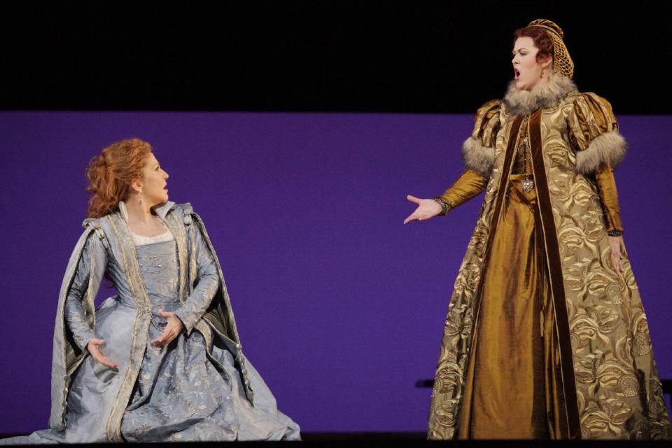 In this April 18, 2012, photo provided by the Houston Grand Opera, Joyce DiDonato, left, performs in the Houston Grand Opera's production of Maria Stuarda, with Katie Van Kooten, right, in Houston. Though the role has often been taken by sopranos who dazzle the audience with their high notes, DiDonato performs a lower-voiced alternate version, which can be just as satisfying. (AP Photo/Houston Grand Opera)