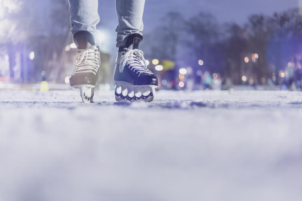 close-up of a person in skates on an ice rink