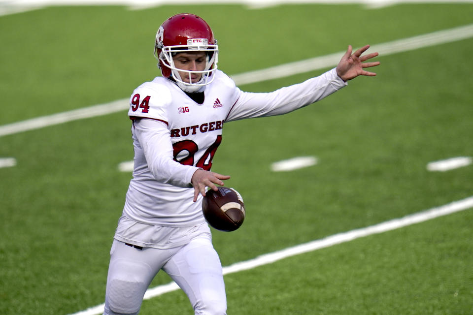 FILE - Rutgers punter Adam Korsak punts to Maryland during the first half of an NCAA college football game in College Park, Md., Saturday, Dec. 12, 2020. (AP Photo/Julio Cortez, File)