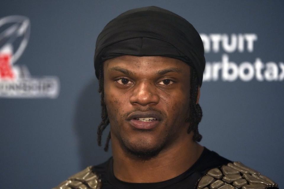 Baltimore Ravens quarterback Lamar Jackson (8) talks during a news conference after the AFC Championship NFL football game against the Kansas City Chiefs, Sunday, Jan. 28, 2024, in Baltimore. The Chiefs won 17-10. (AP Photo/Nick Wass)