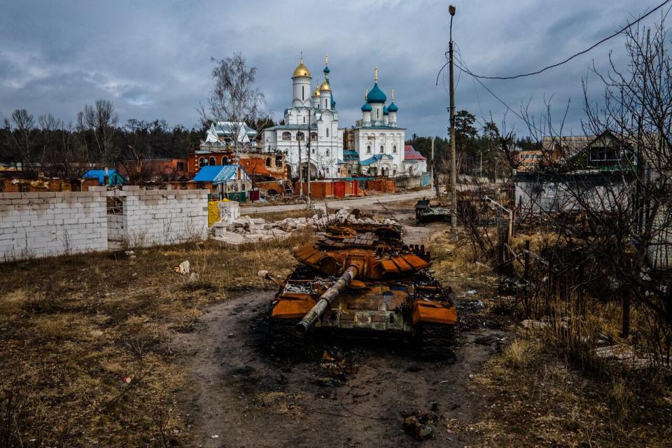 A destroyed Russian T-72 tank is photographed near Pokrovy Presvyatoyi Bohorodytsi Church, in the city of Svyatohirs'k, Donetsk region on March 1, 2023, amid the Russian invasion of Ukraine. 
