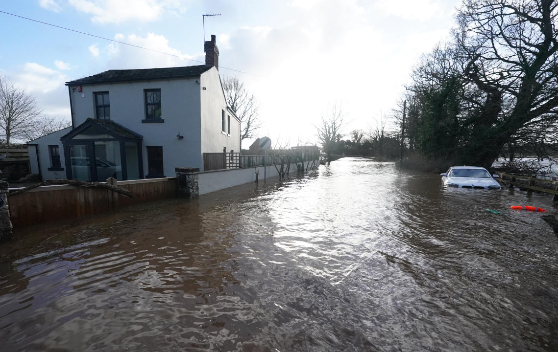 A car stranded in flood water in Warwick bridge in Cumbria. Thousands of people have been left without power as Storm Isha brought disruption to the electricity and transport networks across the UK. Picture date: Monday January 22, 2024. (Photo by Owen Humphreys/PA Images via Getty Images)