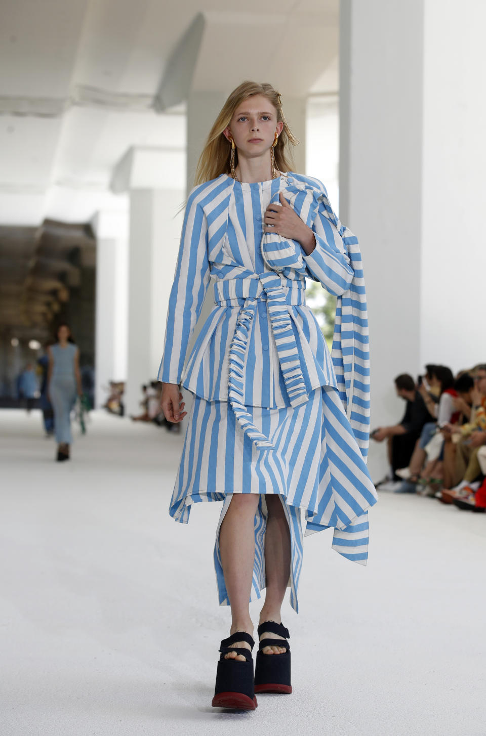 A model wears a creation as part of the Sunnei men's Spring-Summer 2020 collection, unveiled during the fashion week in Milan, Italy, Sunday, June 16, 2019. (AP Photo/Antonio Calanni)