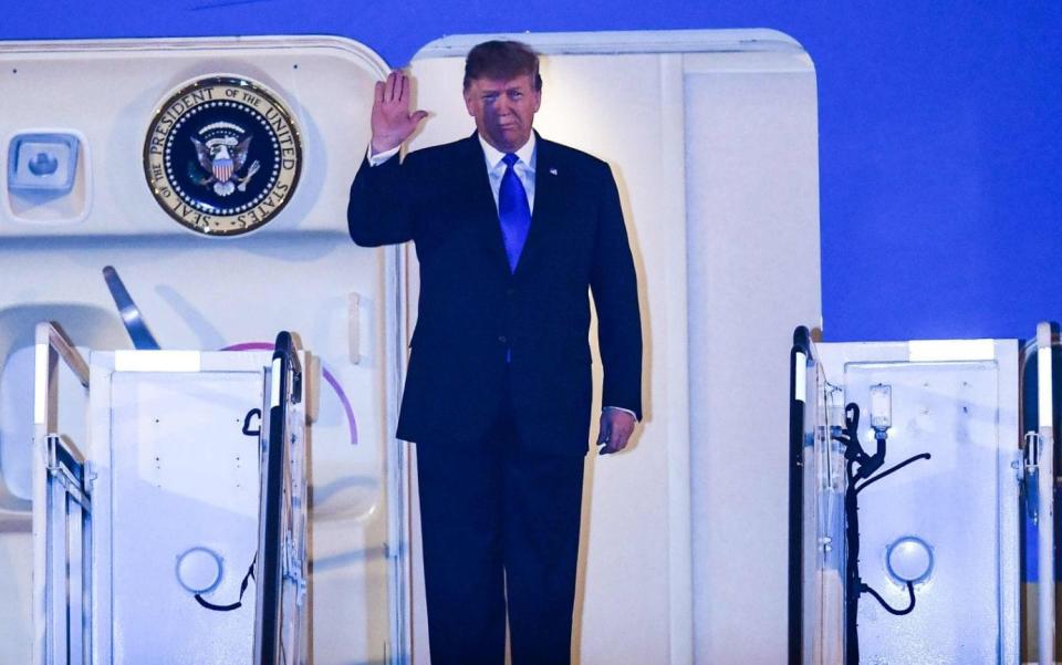 Trump arrived on Air Force One after flying half way around the world from Washington - AFP