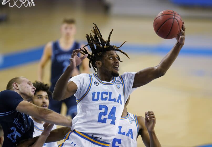 FILE - UCLA forward Jalen Hill grabs a rebound during the first half of the team's NCAA college basketball game.