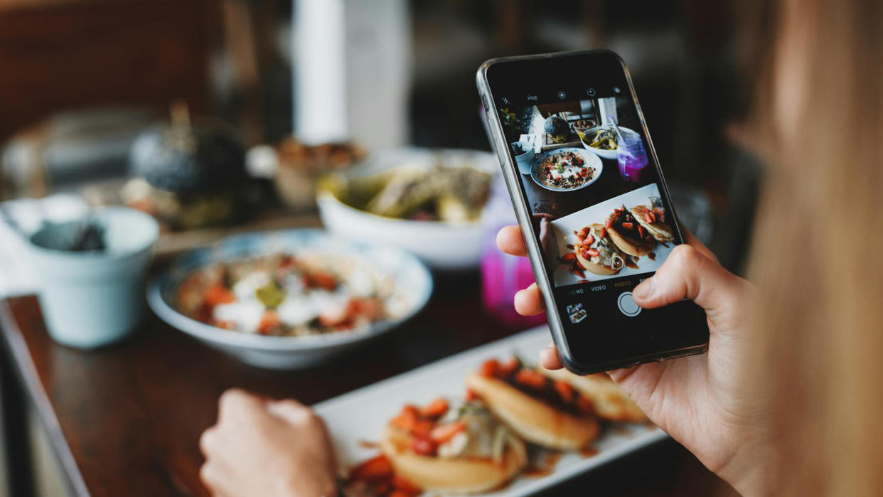  Taking picture of food for the 'gram. 