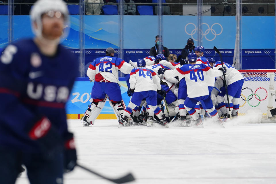 Slovakia players celebrate after beating the United States 3-2 in a shoot-out in a men's quarterfinal hockey game at the 2022 Winter Olympics, Wednesday, Feb. 16, 2022, in Beijing. (AP Photo/Matt Slocum)