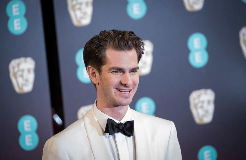 Andrew Garfield attends the 70th EE British Academy Film Awards (BAFTA) in a light-colored tuxedo