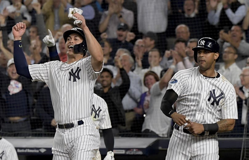 Giancarlo Stanton made a mark in his anticipated postseason debut. (AP)