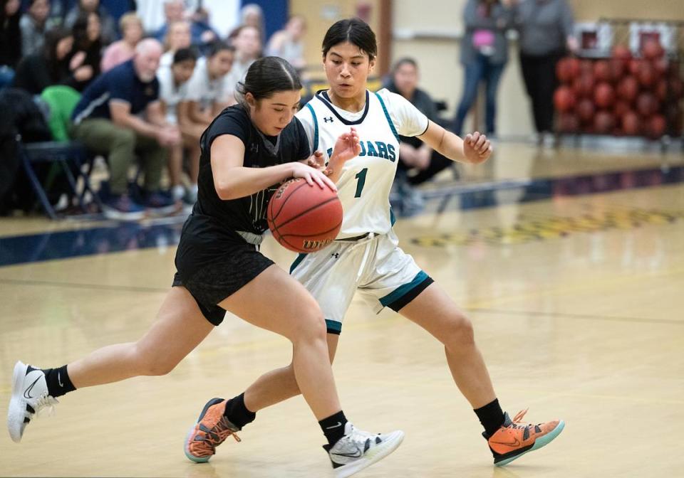 Gregori’s Lilly staggs defends on Tracy’s Gabriella Hernandez during the tournament  game at Gregori High School in Modesto, Calif., Friday, Dec. 8, 2023. 