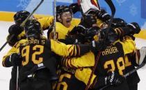 Ice Hockey - Pyeongchang 2018 Winter Olympics - Men's Quarterfinal Match - Sweden v Germany - Kwandong Hockey Centre, Gangneung, South Korea - February 21, 2018 - Bjorn Krupp of Germany (C) celebrates with team mates after the match. REUTERS/Kim Kyung-Hoon