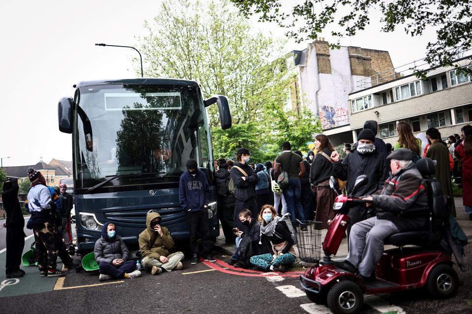 Peckham protesters block a coach due to take refugees to the Bibby Stockholm Barge (AFP via Getty Images)