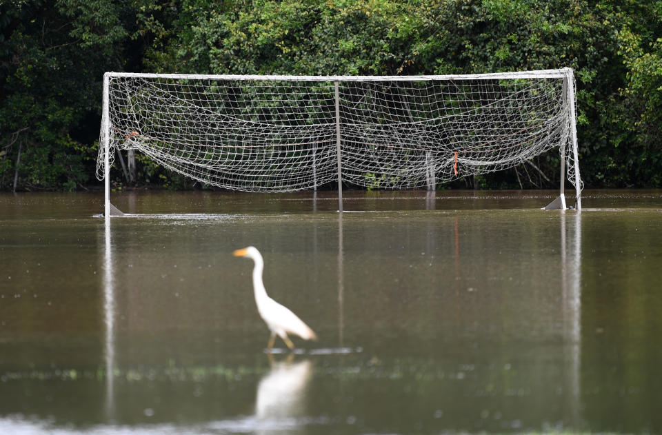 A football field is covered in floodwater in Woombye on the Sunshine Coast.