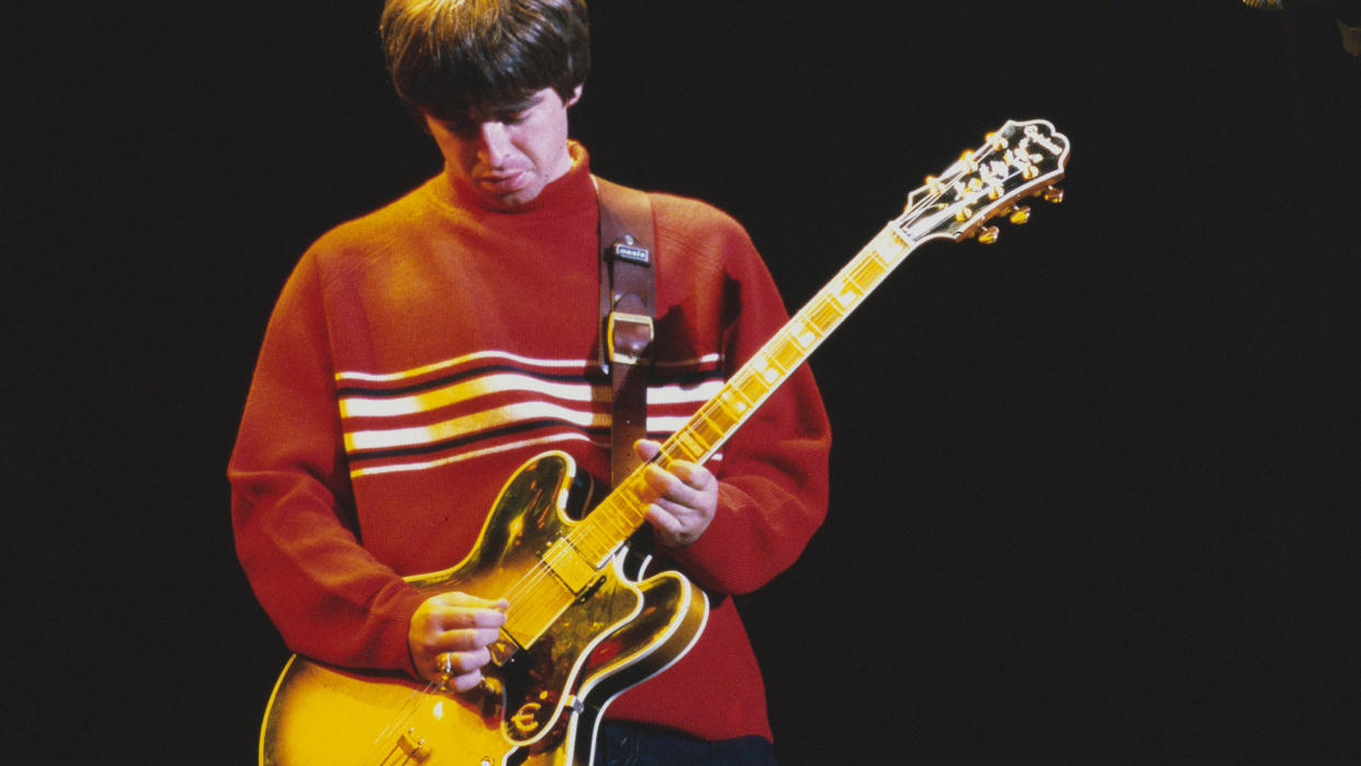  Noel Gallagher playing an Epiphone onstage at Knebworth in the UK in 1996 