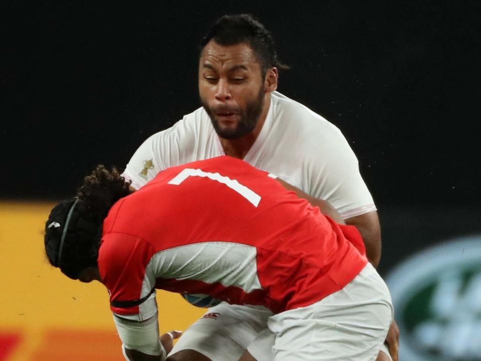 Billy Vunipola was tackled hard by Tonga's Zane Kapeli during England's Rugby World Cup win: Getty