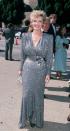 <p>The stunning Carol Brady actor wore a glittery, powder blue dress that did not go light on the shoulder pads.</p>