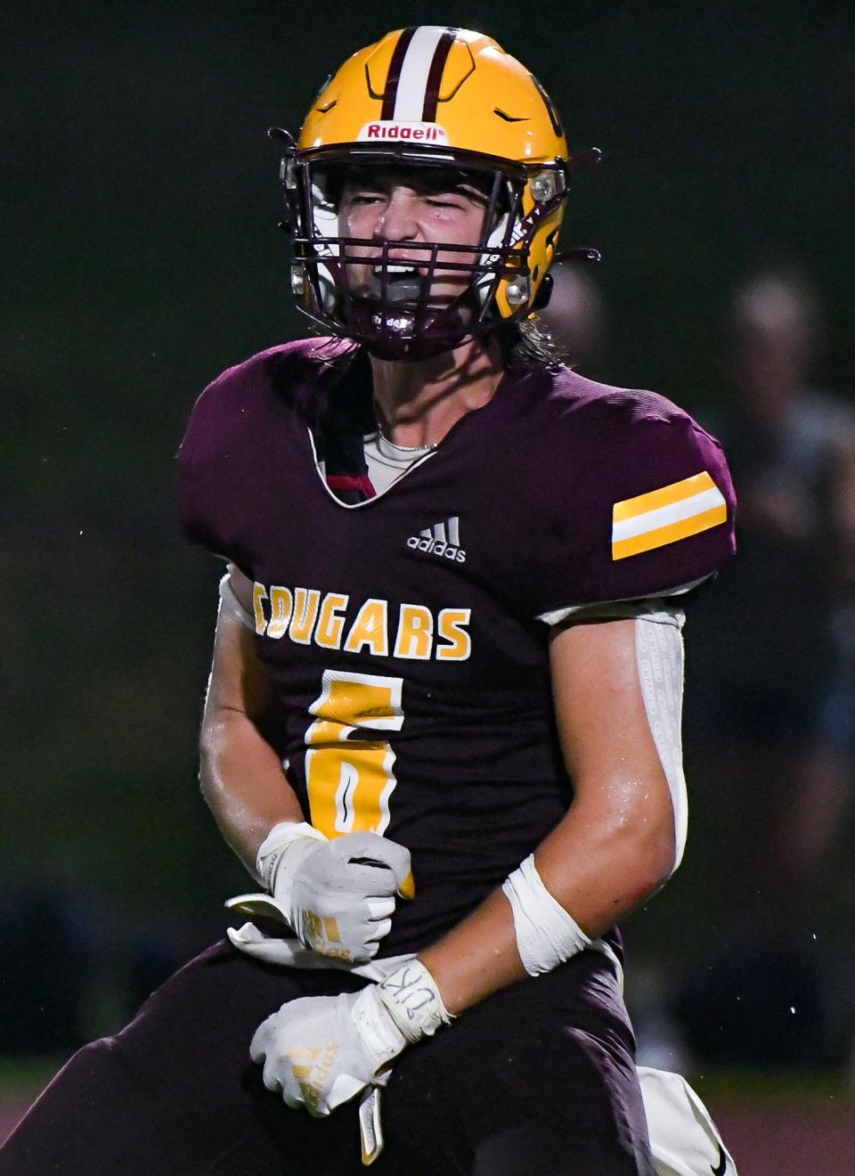 Bloomington North’s Ross Ogden celebrates after sacking BNL quarterback Dayson Kirby during their football game at North on Friday, August 26, 2023.