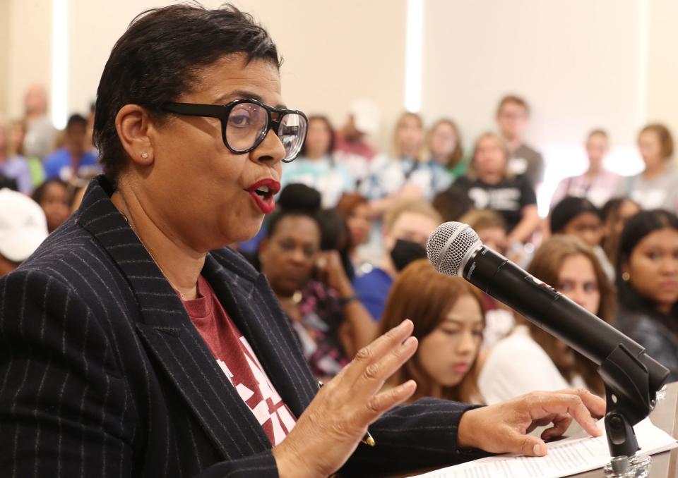 Annette Richardson, an advisor to the LeBron James Family Foundation, addresses the Akron School Board at packed with supporters of the I Promise School in Akron.