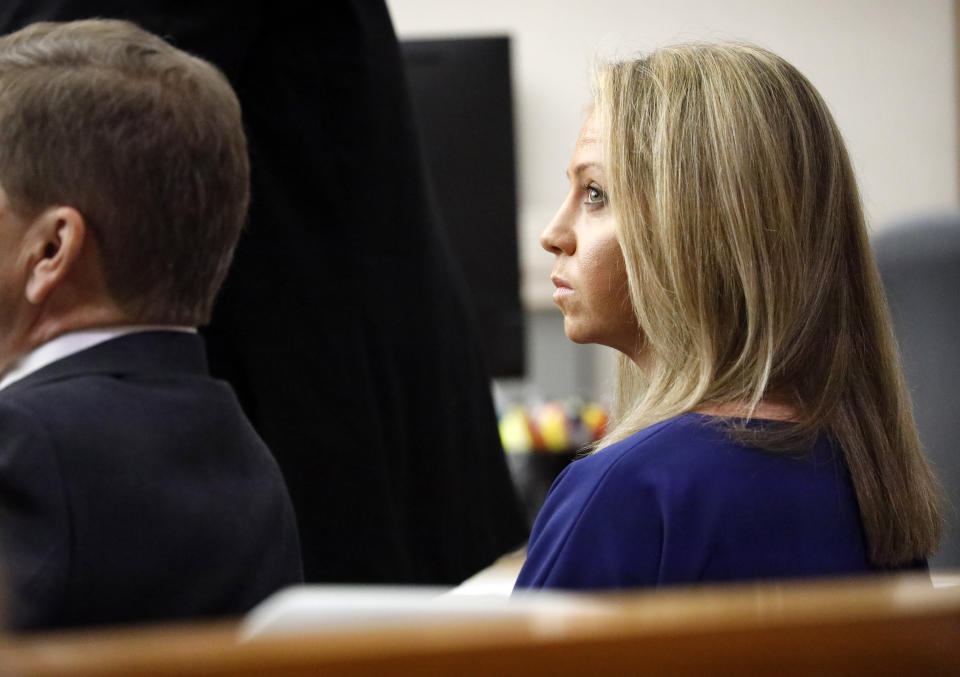Former Dallas police Officer Amber Guyger listens to pretrial arguments in Judge Tammy Kemp's 204th District Court in Dallas, Monday, September 23, 2019. Guyger shot and killed Botham Jean, an unarmed 26-year-old neighbor in his own apartment last year. She told police she thought his apartment was her own and that he was an intruder. (Tom Fox/The Dallas Morning News via AP, Pool)