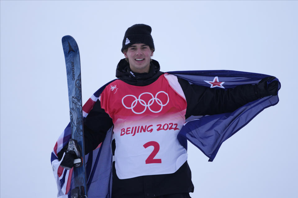 Gold medal winner New Zealand's Nico Porteous celebrates during the venue award ceremony for the men's halfpipe at the 2022 Winter Olympics, Saturday, Feb. 19, 2022, in Zhangjiakou, China. (AP Photo/Lee Jin-man)