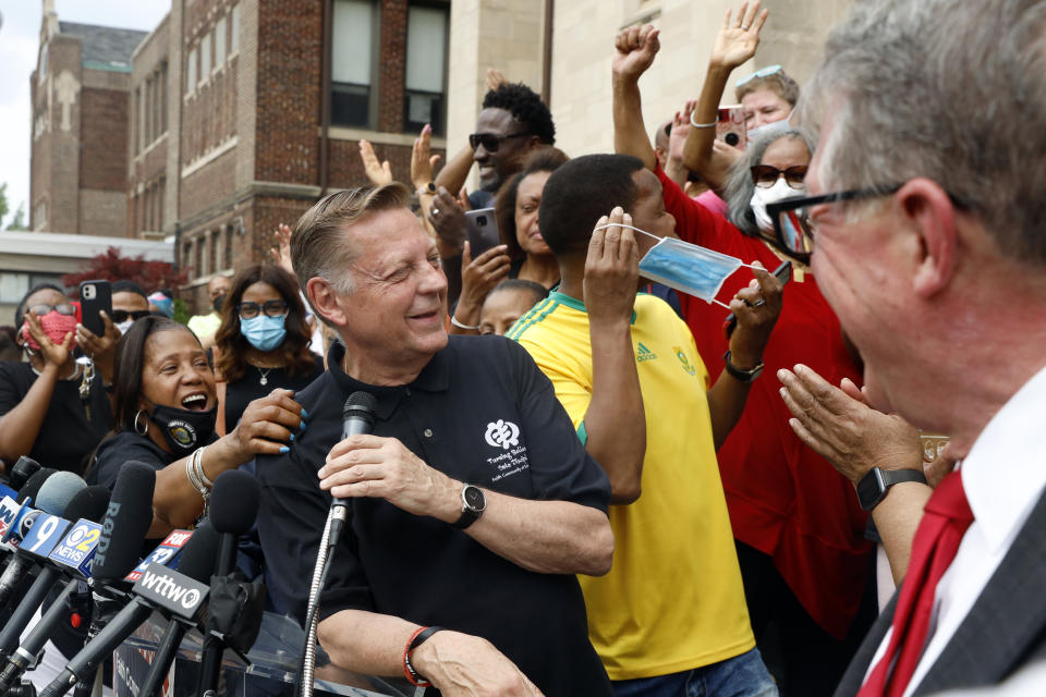 Parishioners of St. Sabina Catholic Church cheers as Father Michael Pfleger speaks for first time during a press conference after his reinstatement as the senior pastor at St. Sabina Church by Archdiocese of Chicago, Monday, May 24, 2021, at St. Sabina Catholic Church in the Auburn Gresham neighborhood in Chicago. (AP Photo/Shafkat Anowar)