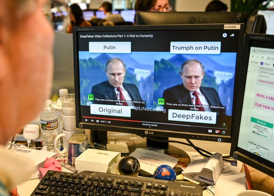 A AFP journalist views a video on January 25, 2019, manipulated with artificial intelligence to potentially deceive viewers, or "deepfake" at his newsdesk in Washington, DC. - "Deepfake" videos that manipulate reality are becoming more sophisticated and realistic as a result of advances in artificial intelligence, creating a potential for new kinds of misinformation with devastating consequences. (Photo by Alexandra ROBINSON / AFP) / TO GO WITH AFP STORY by Rob LEVER "Misinformation woes may multiply with deepfake videos"        (Photo credit should read ALEXANDRA ROBINSON/AFP/Getty Images)