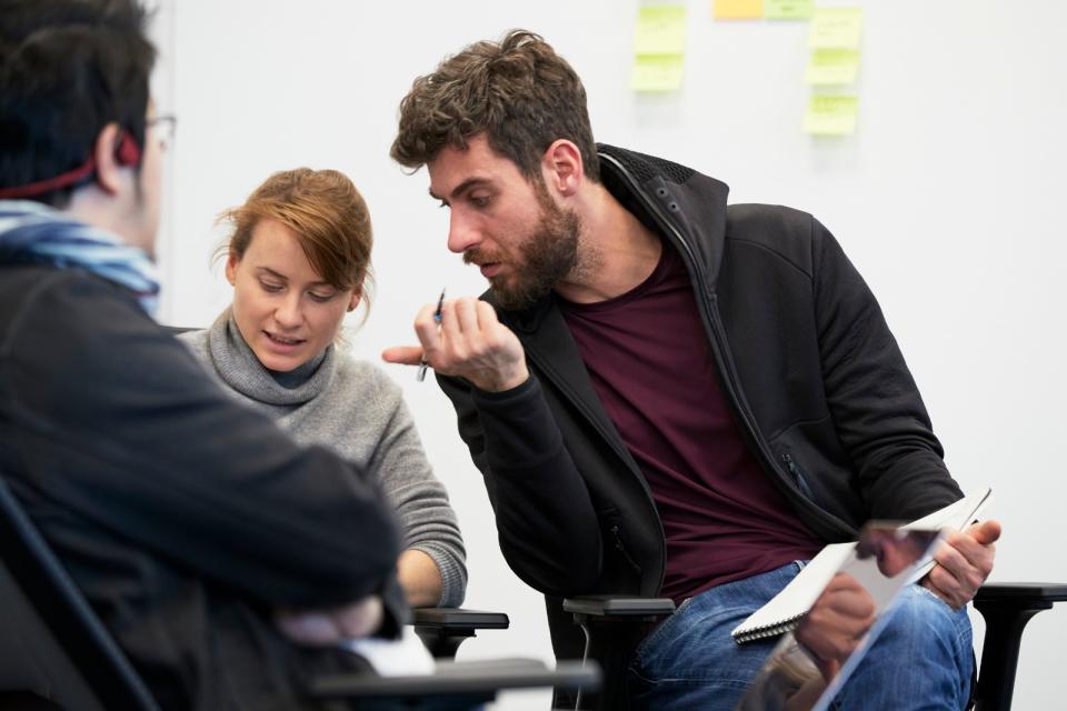 In close quarters: office workers collaborating in the workplace