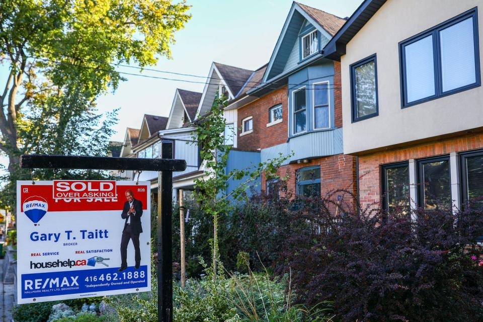 <span class="caption">A sold sign is displayed in front of a house in the Riverdale area of Toronto in September 2021. One of the key reasons for the housing crisis in the Greater Toronto Area is the disparity between increasing housing prices and stagnant household income.</span> <span class="attribution"><span class="source">THE CANADIAN PRESS/Evan Buhler</span></span>