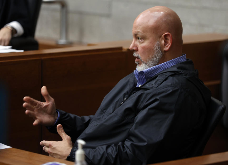 Columbus, Ohio, police detective Jeffery Huhn testifies during a bond hearing for Gerson Fuentes, the man accused of raping a 10-year-old girl who then traveled to Indiana to have an abortion, in Franklin County common pleas court Thursday, July 28, 2022. Judge Julie Lynch denied bond. (AP Photo/Paul Vernon)