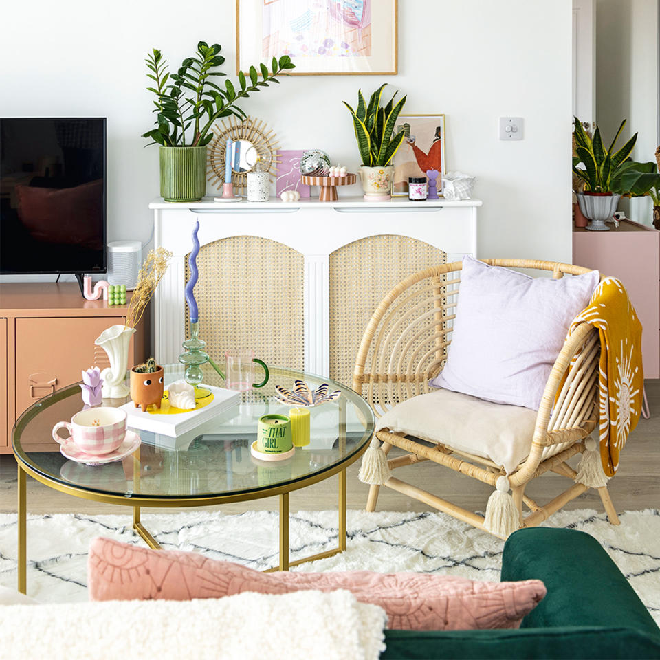 open plan living room with glass coffee table and radiator cover