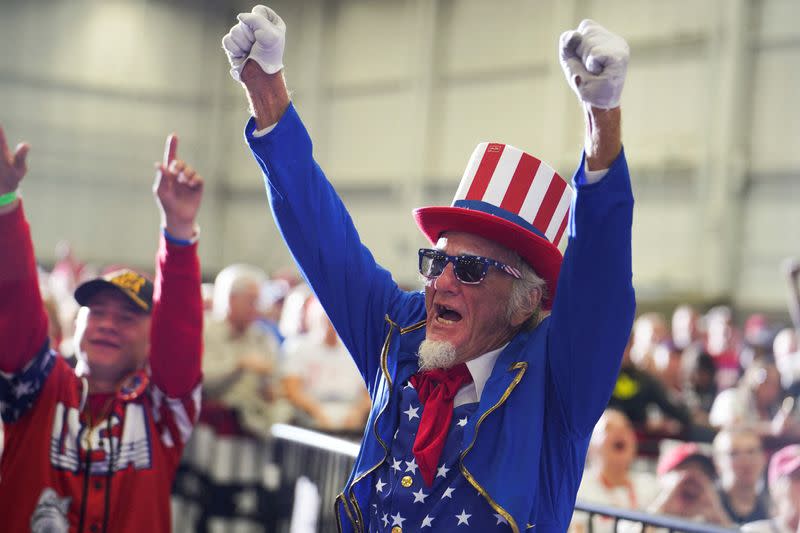 FILE PHOTO: Former U.S. president Donald Trump holds a rally in Warren, Michigan