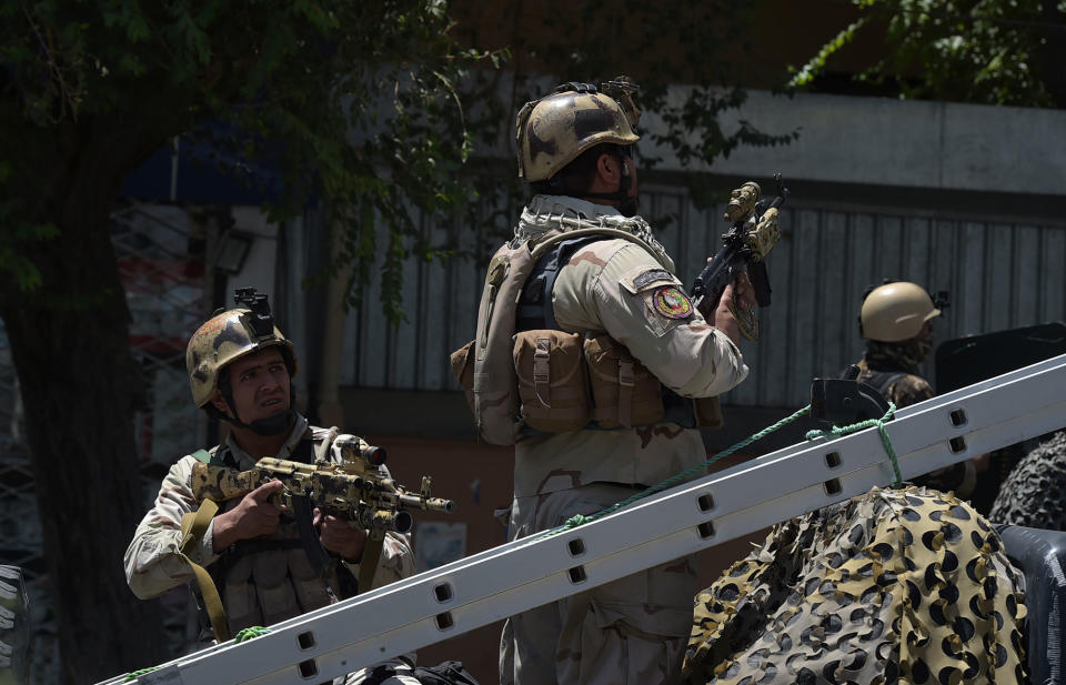 <p>Afghan security forces keep watch at the site of a suicide blast near Iraq’s embassy in Kabul on July 31, 2017.<br> A series of explosions and the sound of gunfire shook the Afghan capital on July 31, with a security source telling AFP that a suicide bomber had blown himself up in front of the Iraqi embassy. “Civilians are being evacuated” from the area as the attack is ongoing, said the official, who declined to be named.<br> (Shah Marai/AFP/Getty Images) </p>