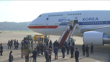 South Korean President Moon Jae-in and First Lady Kim Jung-sook board their plane to depart Seoul Airbase for Pyongyang to hold the third summit with North Korean leader Kim Jong Un in this still frame taken from video September 18, 2018. KBS/via REUTERS TV