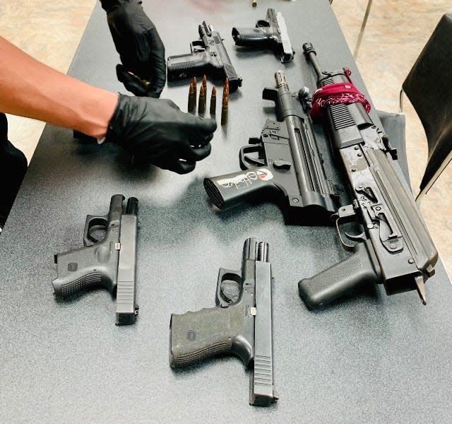 A photo of confiscated weapons, including two of which were stolen.