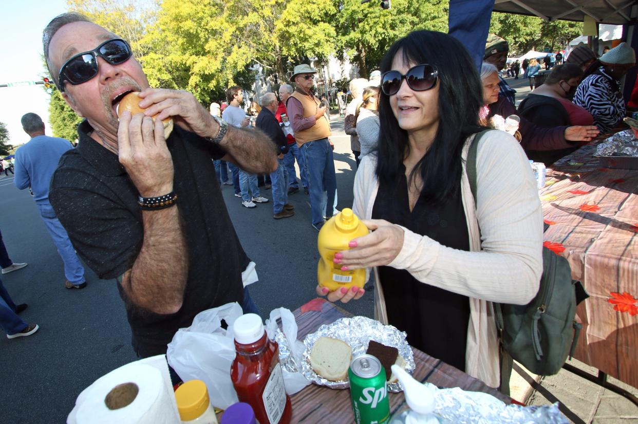 Billy and Kim Brooks get ready to eat their liver mush sandwiches during the Mush, Music and Mutts Festival held Saturday, Oct. 15, 2022, at Court Square in Uptown Shelby.