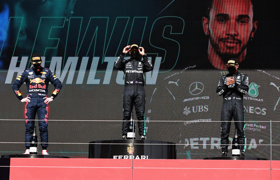 Second placed Max Verstappen (pictured left), race winner Lewis Hamilton (pictured middle) and third placed Valtteri Bottas (pictured right) stand on the podium after the F1 Grand Prix of Portugal at Autodromo Internacional Do Algarve on May 02, 2021 in Portimao, Portugal. 