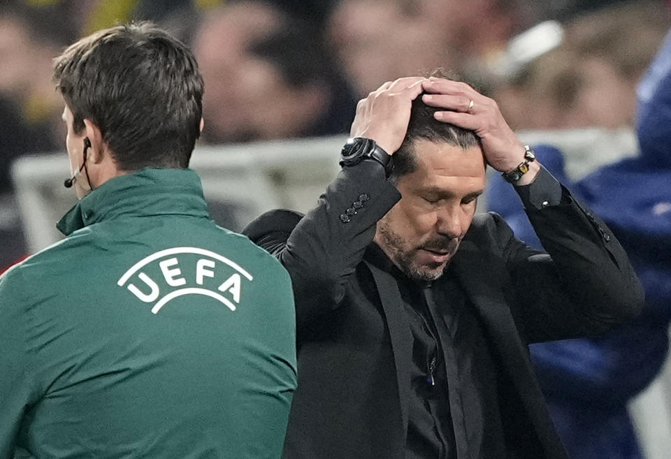 Atletico Madrid's head coach Diego Simeone reacts after a missed goal chance during the Champions League quarterfinal second leg soccer match between Borussia Dortmund and Atletico Madrid at the Signal-Iduna Park in Dortmund, Germany, Tuesday, April 16, 2024(AP Photo/Martin Meissner)