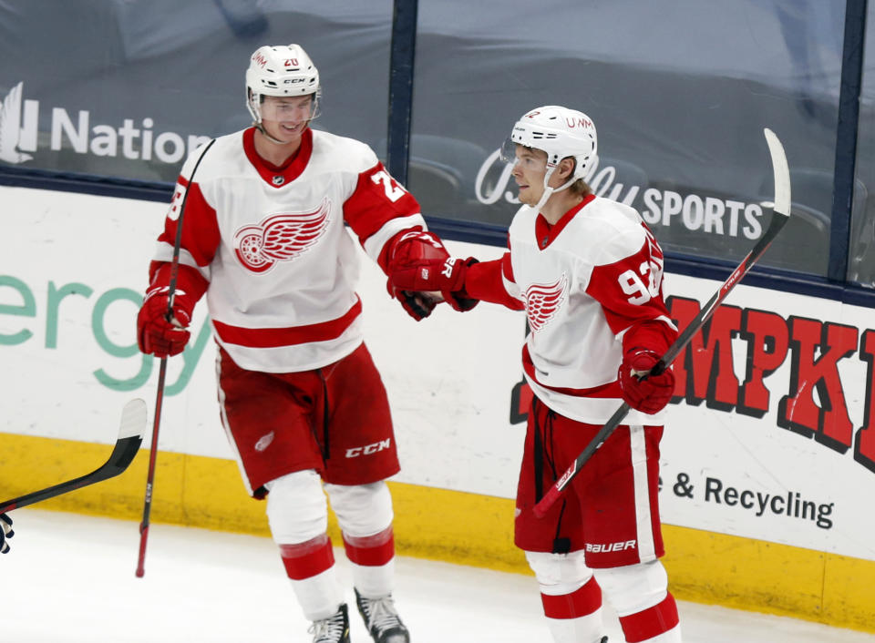 Detroit Red Wings' Vladislav Namestnikov, right, celebrates his goal with Gustav Lindstrom during the third period of the team's NHL hockey game against the Columbus Blue Jackets in Columbus, Ohio, Friday, May 7, 2021. The Red Wings won 5-2. (AP Photo/Paul Vernon)