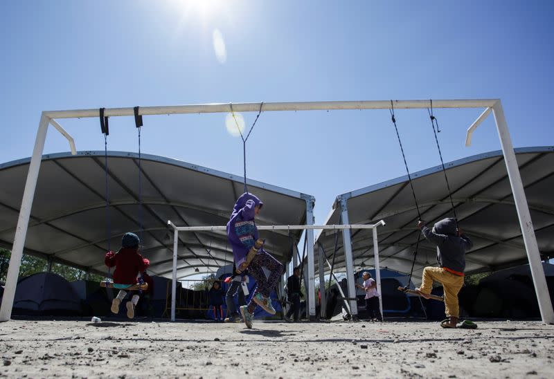 Migrant kids, asylum seekers sent back to Mexico from the U.S. under the Remain in Mexico program officially named Migrant Protection Protocols (MPP), are seen playing at provisional campsite near the Rio Bravo in Matamoros