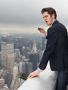 Celebrity photos: During his promotional trail for the new Spiderman movie, Andrew Garfield made a trip to the top of the Empire State building. He was so overwhelmed by the view that he whipped out his iPhone and started taking pictures. Copyright [Rex]