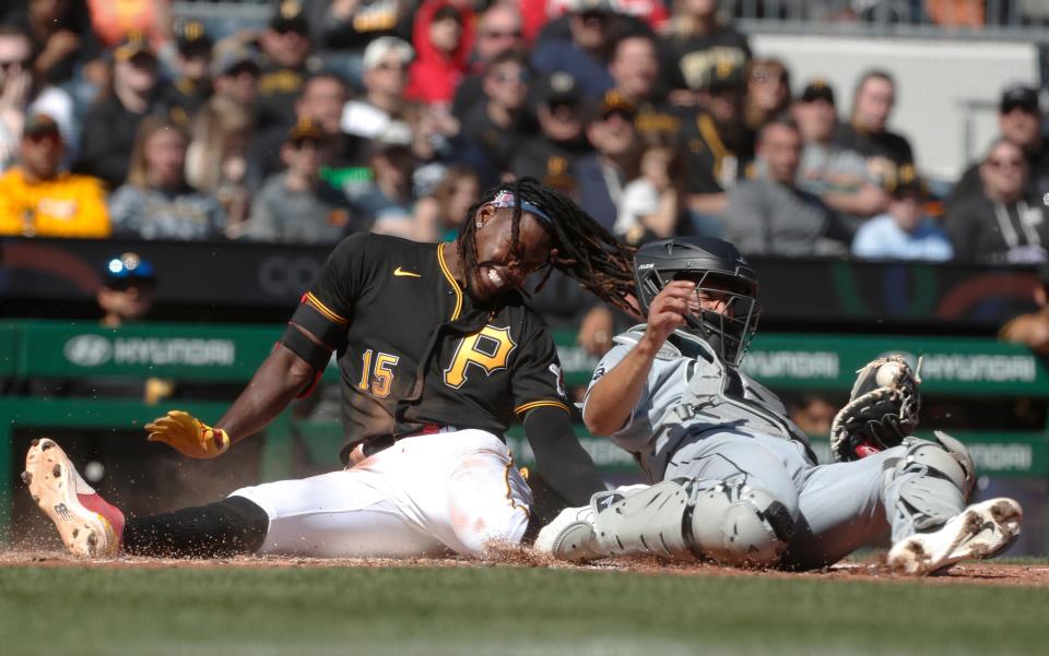 White Sox catcher Seby Zavala hangs onto the ball after tagging the Pirates' Oneil Cruz out at home in the sixth inning at PNC Park.