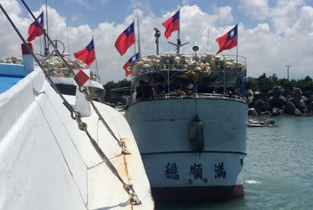 A Taiwanese fishing boat sets sail to Itu Aba, which Taiwan calls Taiping, Taiwan's sole holding in the disputed Spratly Islands, in protest against a tribunal's ruling on the South China Sea, in Pingtung, Taiwan July 20, 2016. REUTERS/Damon Lin