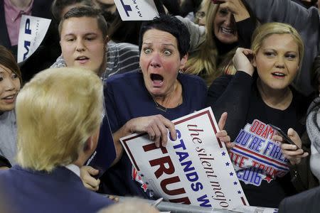 Audience member Robin Roy (C) reacts as U.S. Republican presidential candidate Donald Trump greets her at a campaign rally in Lowell, Massachusetts January 4, 2016. REUTERS/Brian Snyder